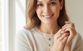 a women wear gemstone pendants amethyst, peridot and clear quartz for good luck