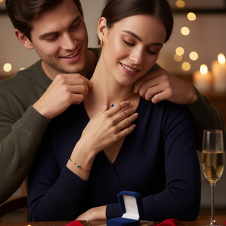 Romantic moment of a couple celebrating anniversary, surrounded by candles, rose petals, and lights—symbolizing love, celebration, and meaningful gemstone jewelry.