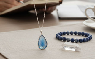 Crystal pendant and bracelet in background interviewee