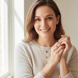 a women wear gemstone pendants amethyst, peridot and clear quartz for good luck