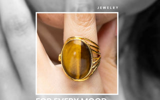 A finger wearing gemstone ring emphasizing on mood and goal related crystal 