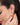 Close-up of a woman wearing a 925 silver ear cuff with her hand near her ear.