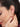 Close-up of a woman wearing a 925 silver ear cuff with her hand near her ear.
