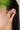 A model wearing 925 sterling silver ear cuff with Rhodium plating, featuring three oval bezel set amethyst stones connected by pavé-set CZ accents in a curved ear climber design.
