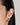 a model wearing round 925 sterling silver rhodium plated stud earrings featuring bezel-set peridot gemstones and textured edge detailing.