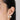 Woman wearing pearl stud earrings in 18K gold plated 925 sterling silver featuring a modern double pearl design.