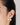 Woman wearing pearl stud earrings in 18K gold plated 925 sterling silver featuring a modern double pearl design.