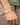 Man wearing personalized men's bracelet in 925 sterling silver with 18K gold plating and custom engraved nameplate on a classic curb chain bracelet.