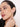 A model wearing 925 sterling silver hoop earrings with alternating black and clear cubic zirconia stones in a sleek pavé setting.
