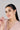 Woman wearing pearl stud earrings in 18K gold plated 925 sterling silver featuring a modern double pearl design.
