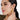 A model wearing Circular shaped hoop earrings featuring bezel-set clear quartz gemstones in 925 sterling silver with 18K gold plating