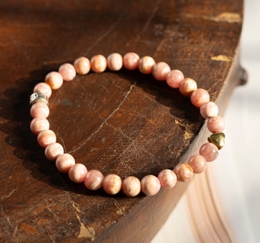 Rhodochrosite with heart charm