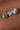 925 sterling silver brooch featuring natural seraphinite gemstones, pavé accents, and cascading chain details.