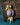 Gold-plated bird brooch featuring a natural charoite gemstone body and amethyst accent.