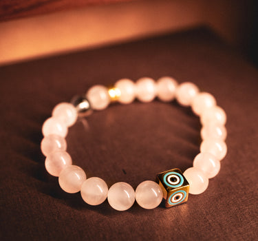 JANUARY- ROSE QUARTZ WITH EVIL EYE CHARM