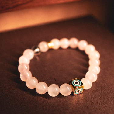 JANUARY- ROSE QUARTZ WITH EVIL EYE CHARM