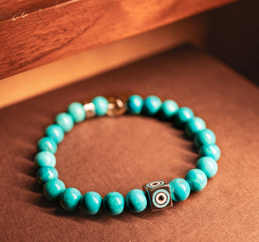 DECEMBER-TURQUOISE WITH EVIL EYE CHARM