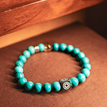 DECEMBER-TURQUOISE WITH EVIL EYE CHARM