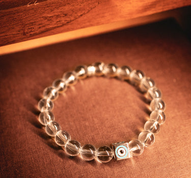 APRIL- CLEAR QUARTZ WITH EVIL EYE CHARM