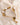 925 sterling silver bracelet with 18K gold plating, featuring freshwater pearls and intricate woven chain links with an adjustable slider closure.