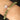 Jade healing crystal bracelet worn on the wrist with a sterling silver flower charm, showcasing green gemstone beads believed to promote balance, prosperity, protection, and well-being.